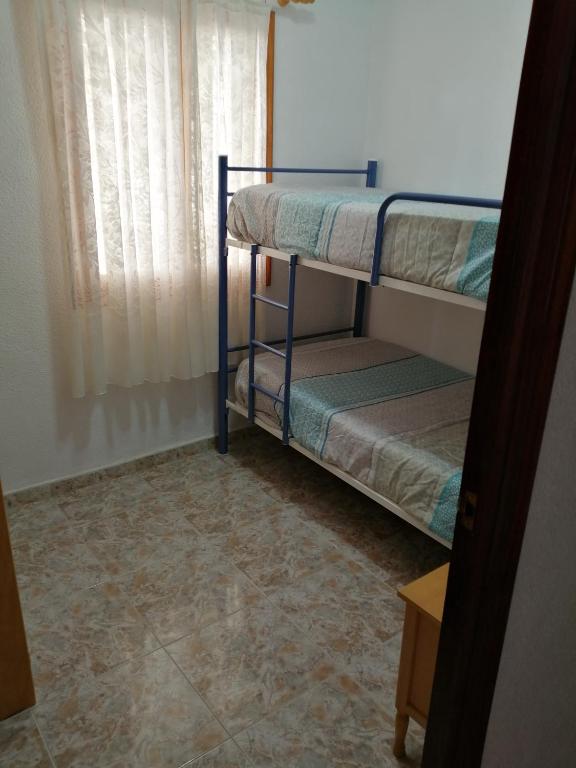 Cama o camas de una habitación en Bungalow Catral 20 en Santa Pola