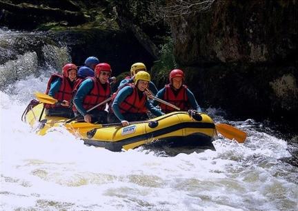 a group of people in a raft in a river at Hotel de Bourgogne in Saulieu