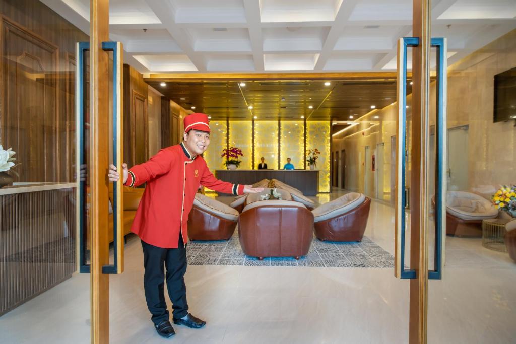 A doorman welcomes guests through the lobby entrance.