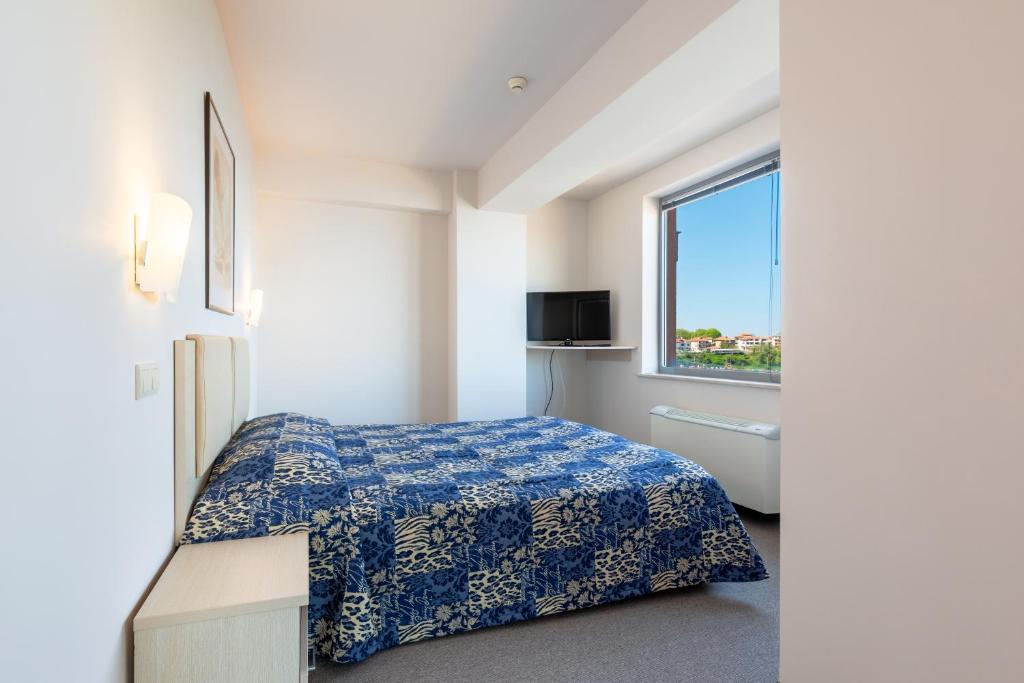 Postel nebo postele na pokoji v ubytování Neven Hotel