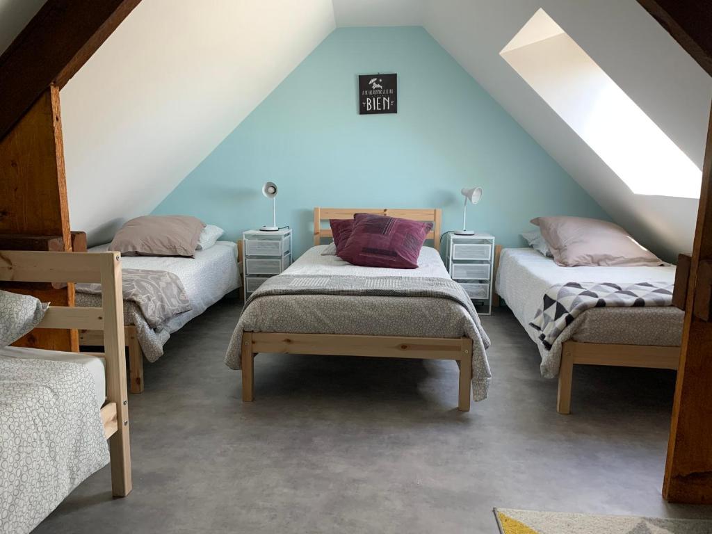 Ένα ή περισσότερα κρεβάτια σε δωμάτιο στο chez marîo