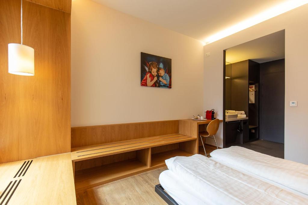 Letto o letti in una camera di Hotel by Hyve Basel