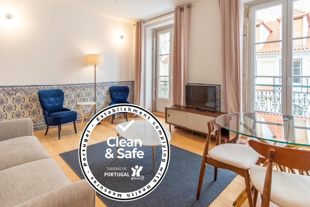 a living room with a sign that says clean and safe at FS Boutique Downtown in Lisbon