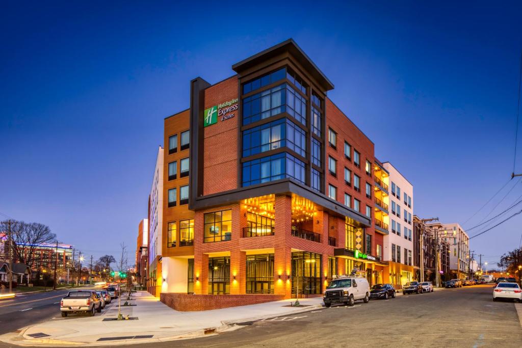 a building on a street with cars parked in front of it at Holiday Inn Express & Suites - Charlotte - South End, an IHG Hotel in Charlotte