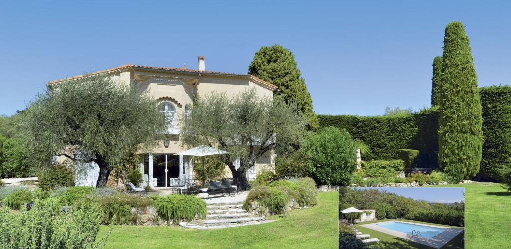 a house with a garden and a swimming pool at Clos Notre Dame in Mouans-Sartoux