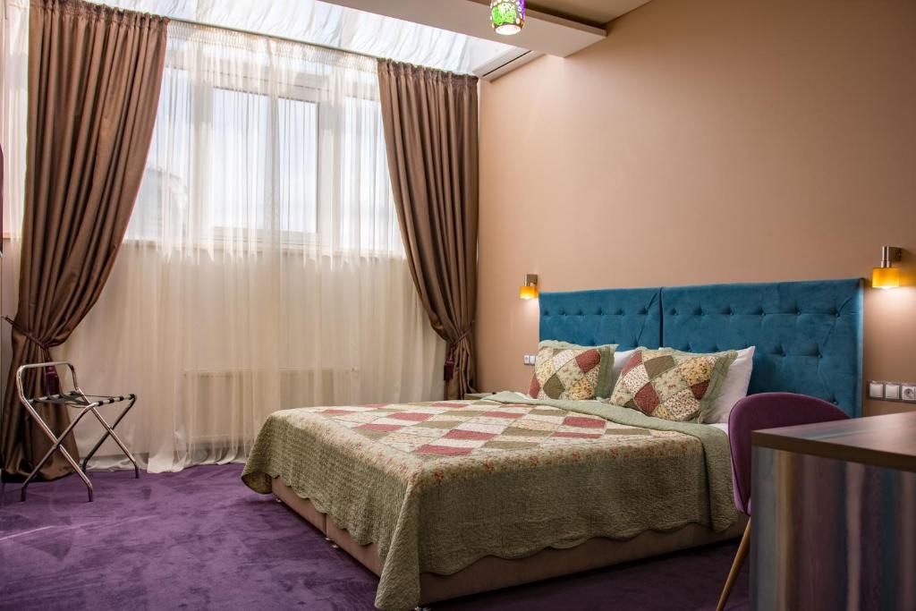 Postel nebo postele na pokoji v ubytování Horizon Hotel