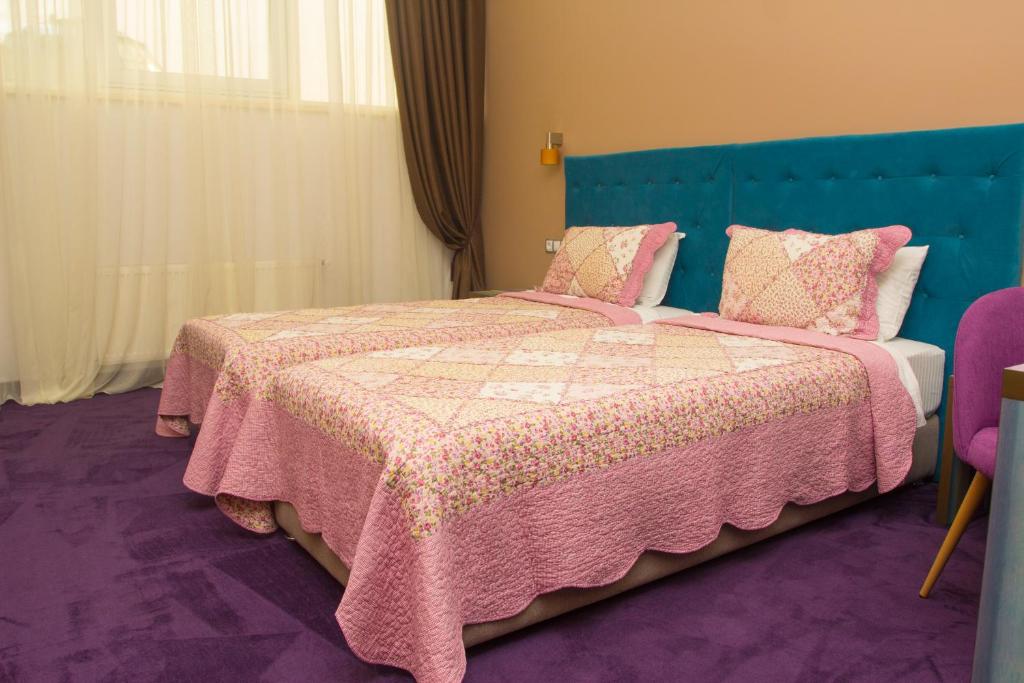 Postel nebo postele na pokoji v ubytování Horizon Hotel