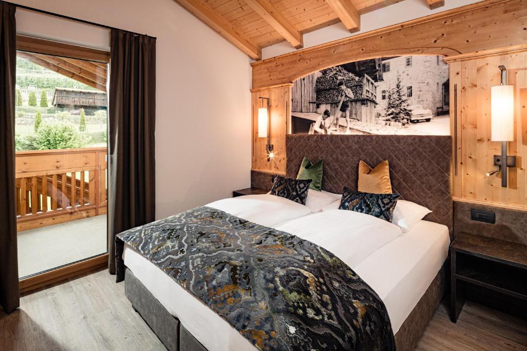 Postel nebo postele na pokoji v ubytování Hotel Brunnhofer