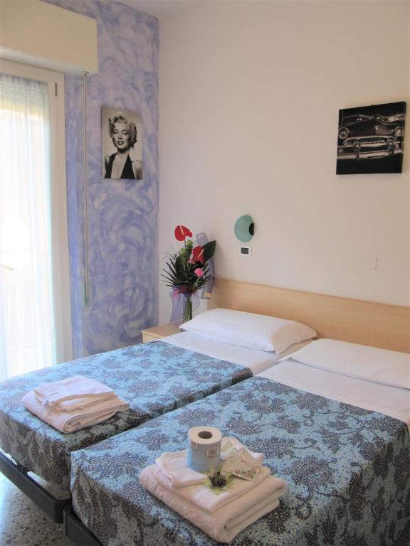 Postel nebo postele na pokoji v ubytování Hotel Villa Elia