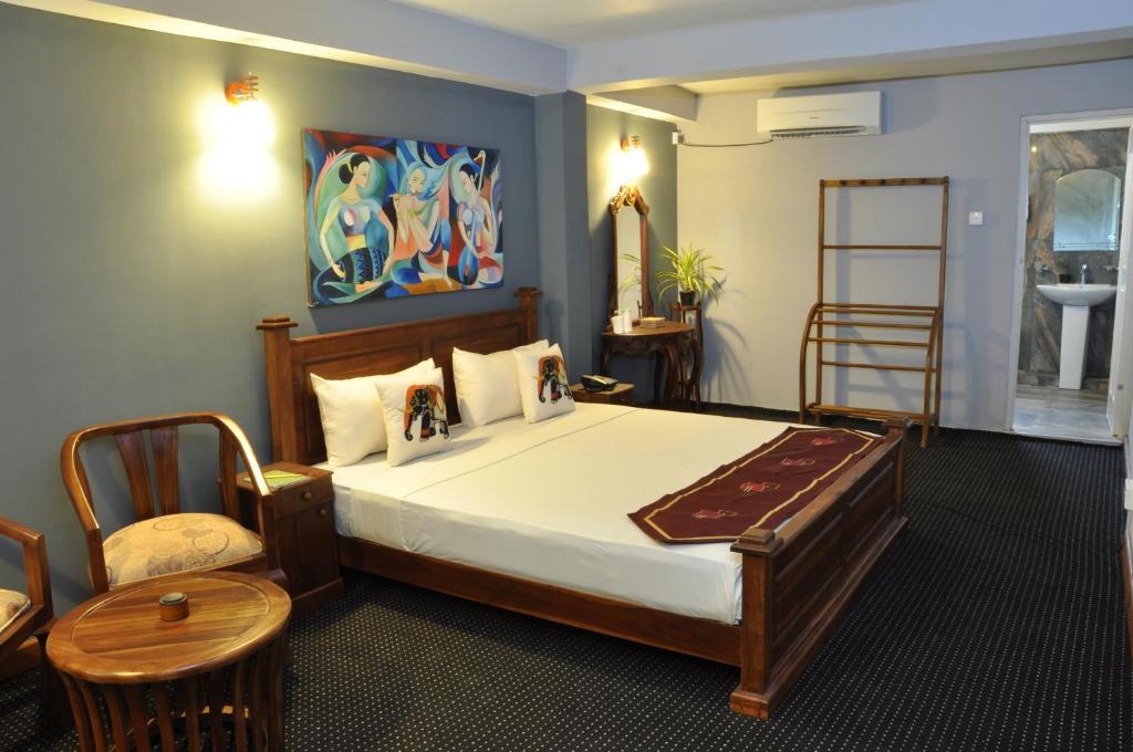 Postel nebo postele na pokoji v ubytování Hotel Tinaya