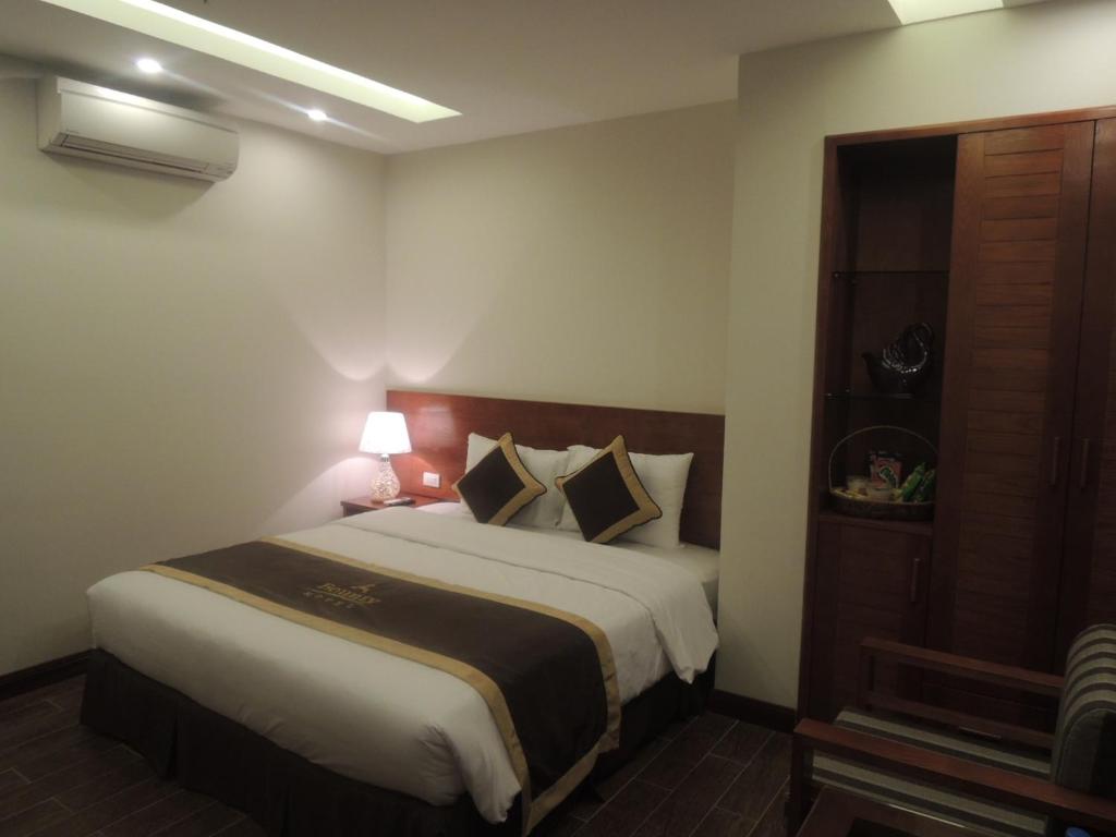 Postel nebo postele na pokoji v ubytování Bounty Hotel