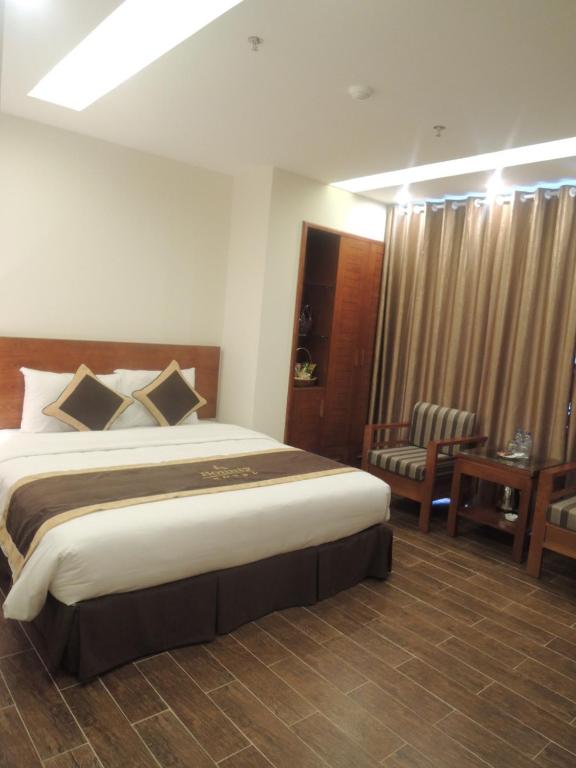 Postel nebo postele na pokoji v ubytování Bounty Hotel