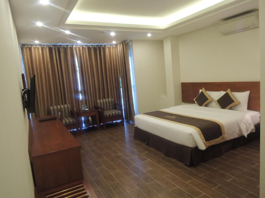 Postel nebo postele na pokoji v ubytování Bounty Hotel