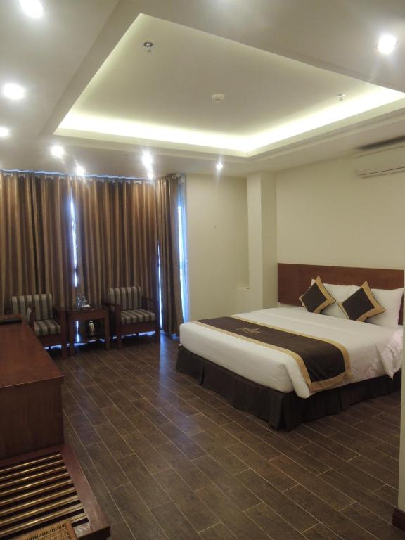 Postel nebo postele na pokoji v ubytování Bounty Hotel