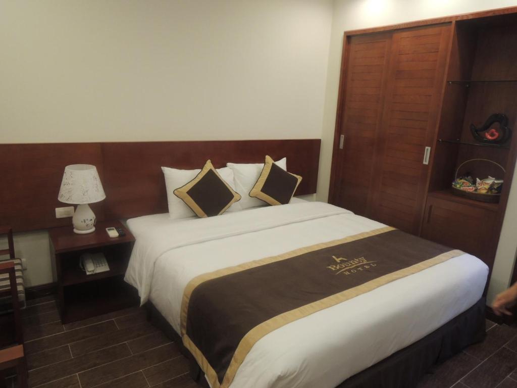 Postel nebo postele na pokoji v ubytování Bounty Hotel