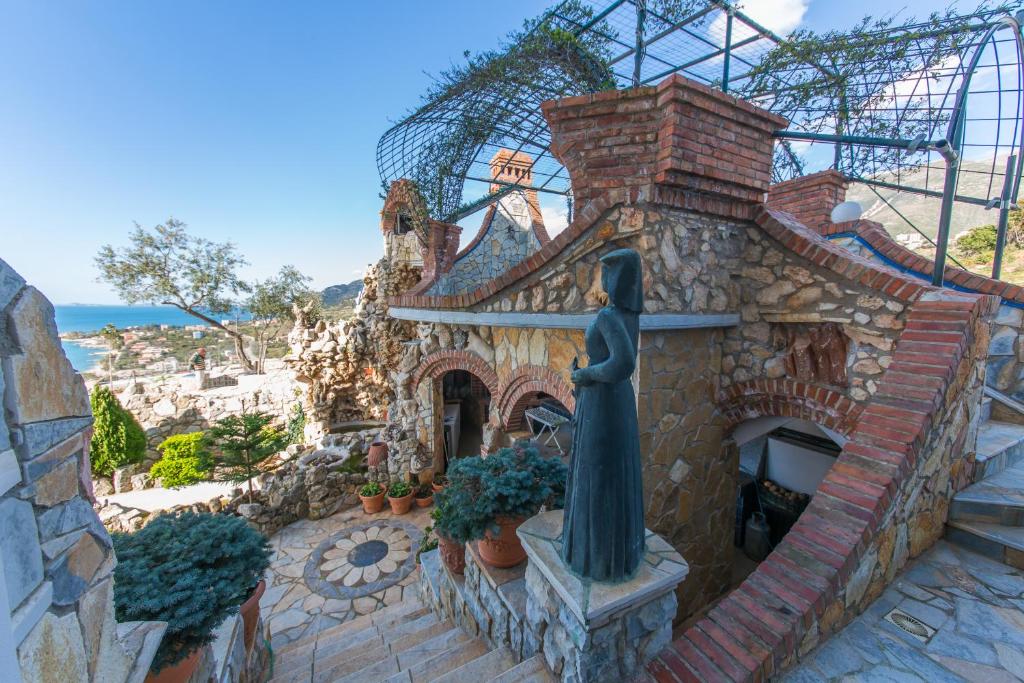 a building with a statue of a woman on it at Hotel Artisti in Vlorë