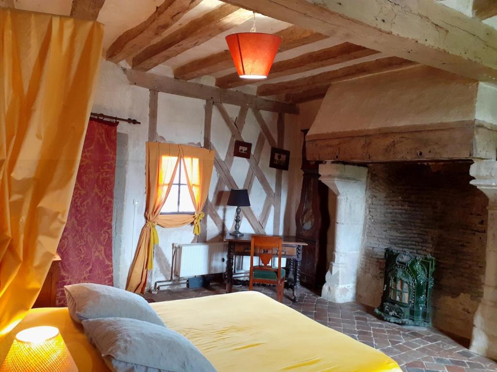 En eller flere senger på et rom på Chateau de Chémery