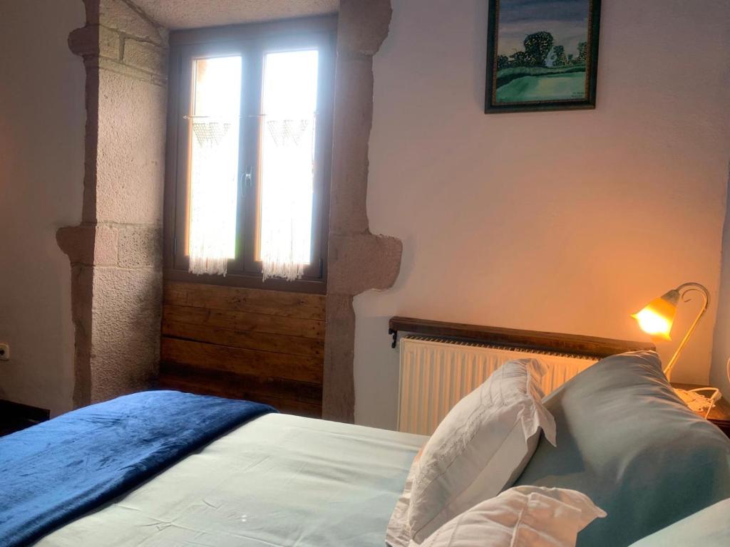 Postel nebo postele na pokoji v ubytování Posada de Ziga