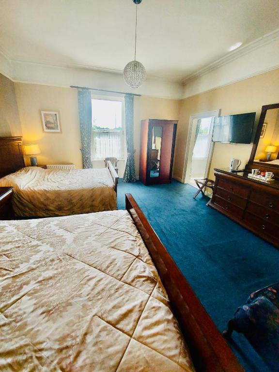 Letto o letti in una camera di Belvedere Lodge