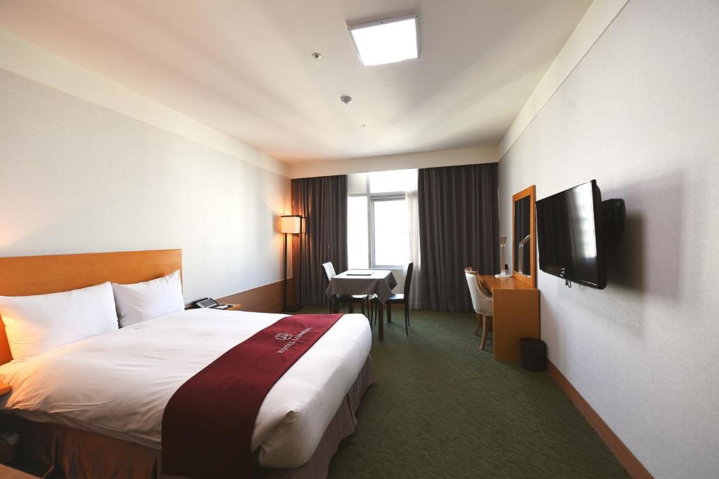 Postel nebo postele na pokoji v ubytování Hotel Laonzena