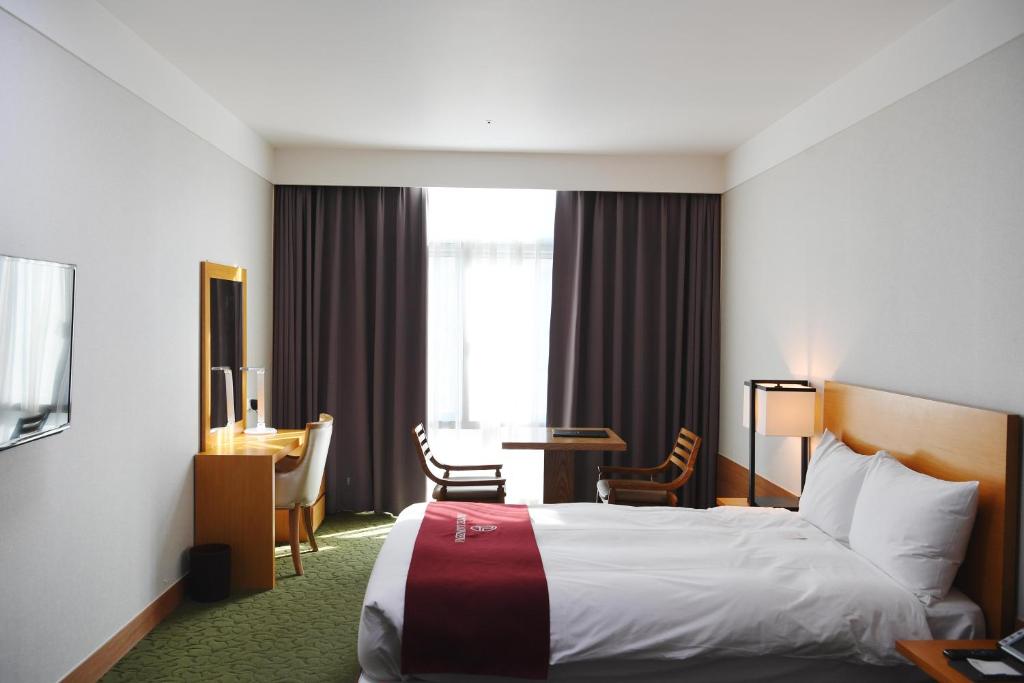 Postel nebo postele na pokoji v ubytování Hotel Laonzena