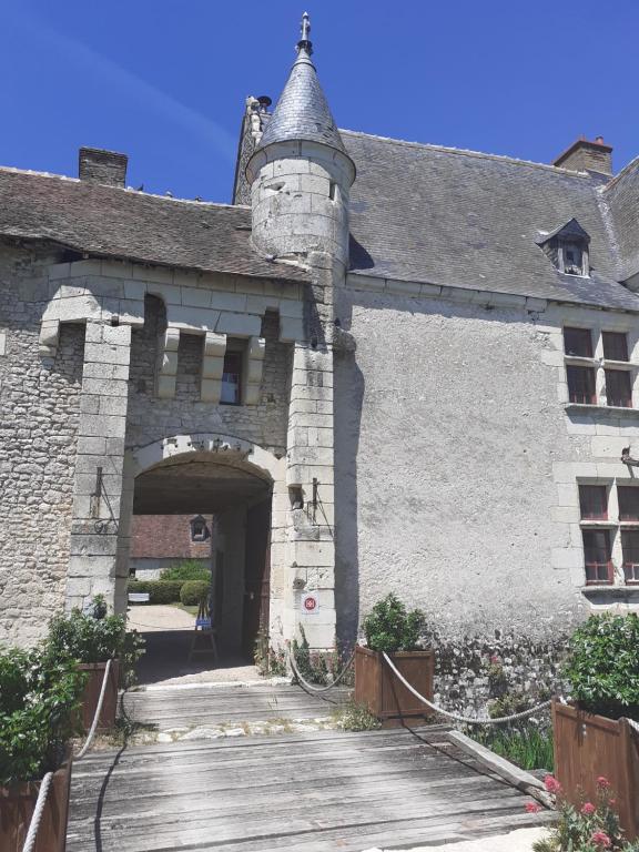 an entrance to a building with an archway at Chateau de Chémery in Chémery