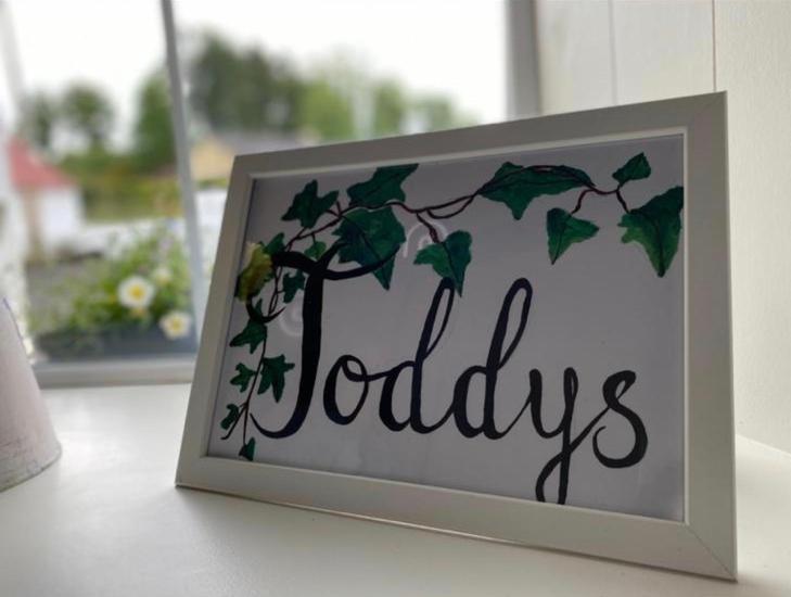 a sign with the word holidays sitting on a table at Toddys Cottage & Stables in Cavan