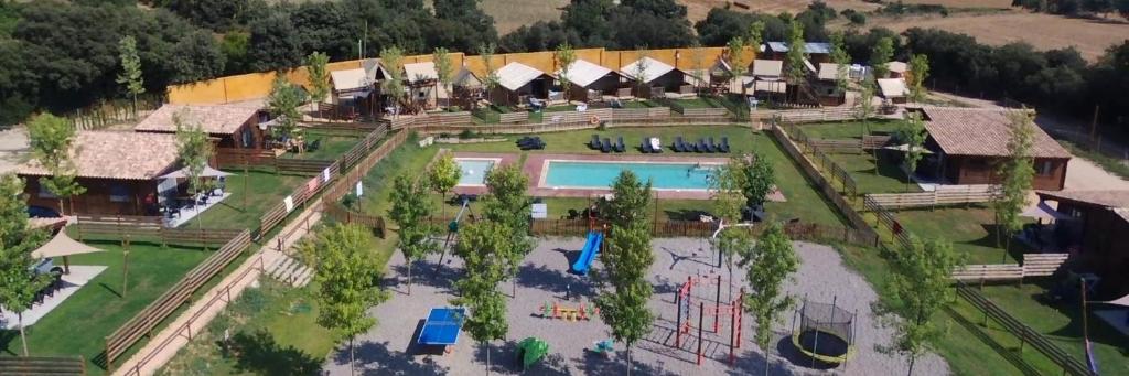 an aerial view of a house with a swimming pool at Càmping Rural Montori in Ultramort