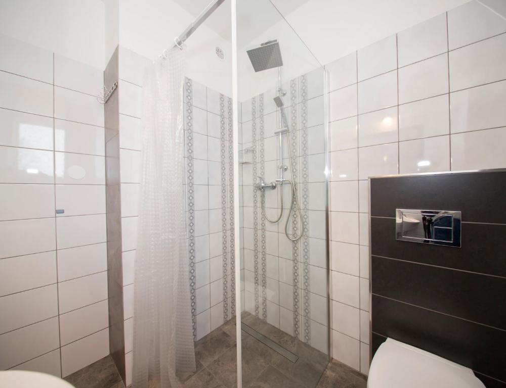 Kúpeľňa v ubytovaní Apartamenty Harenda 39