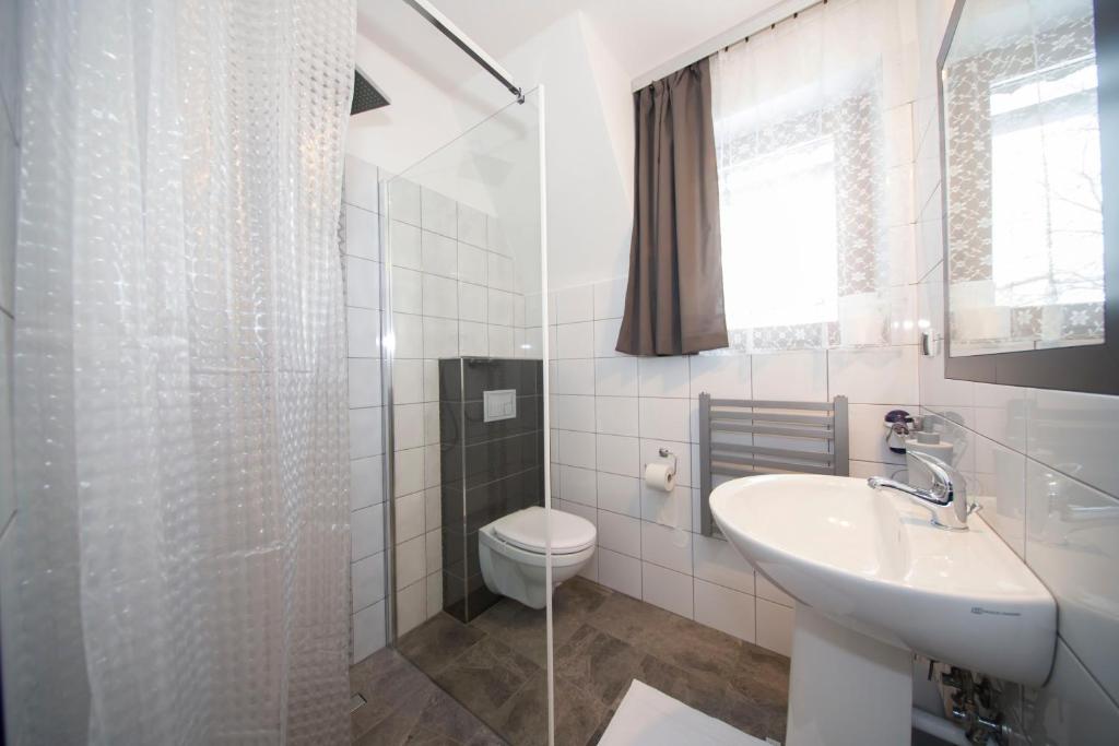 Kúpeľňa v ubytovaní Apartamenty Harenda 39