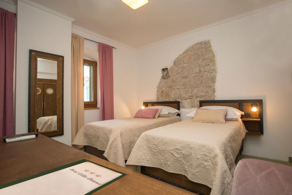 Postel nebo postele na pokoji v ubytování Hotel Villa Diana
