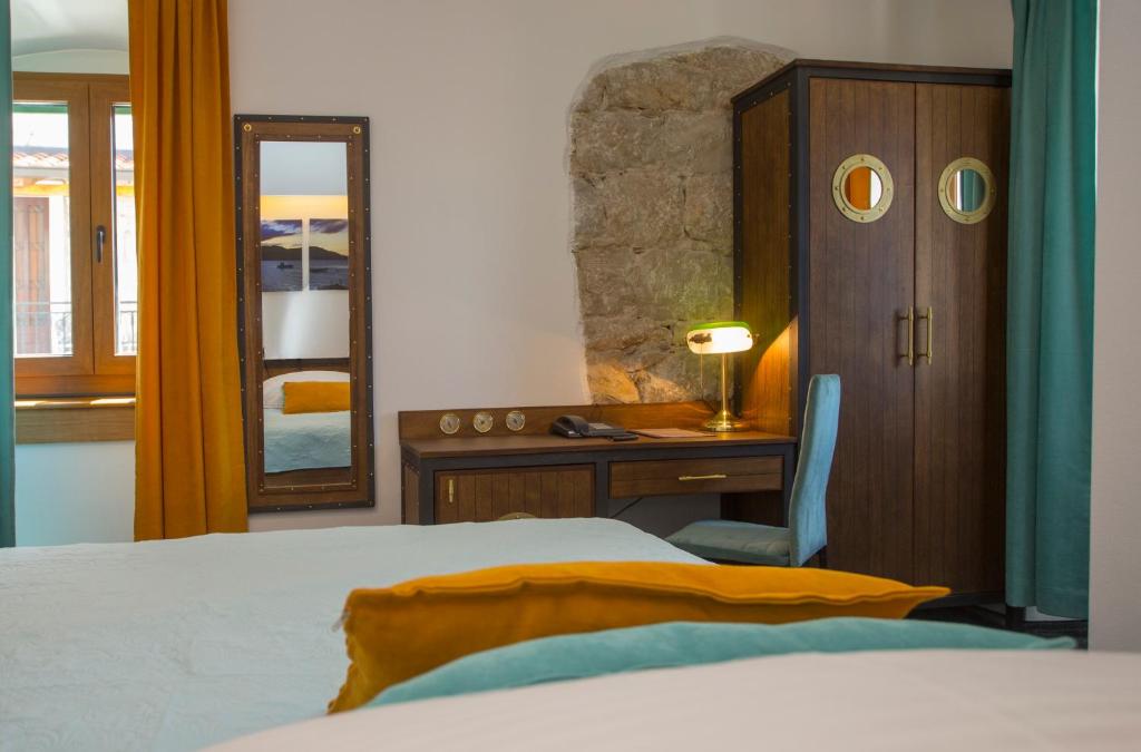 Postel nebo postele na pokoji v ubytování Hotel Villa Diana