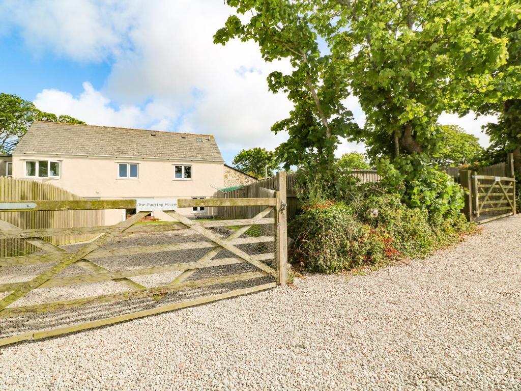 a wooden gate in front of a house at The Packing House in Penzance