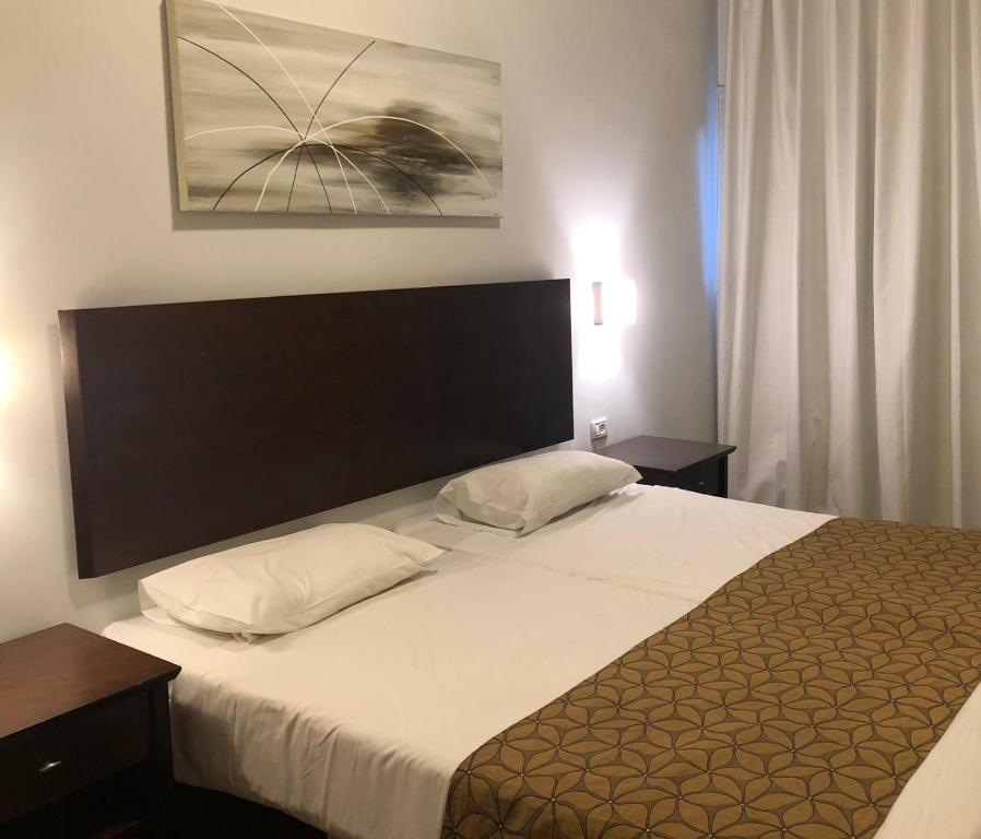 Postel nebo postele na pokoji v ubytování Restal Hotel