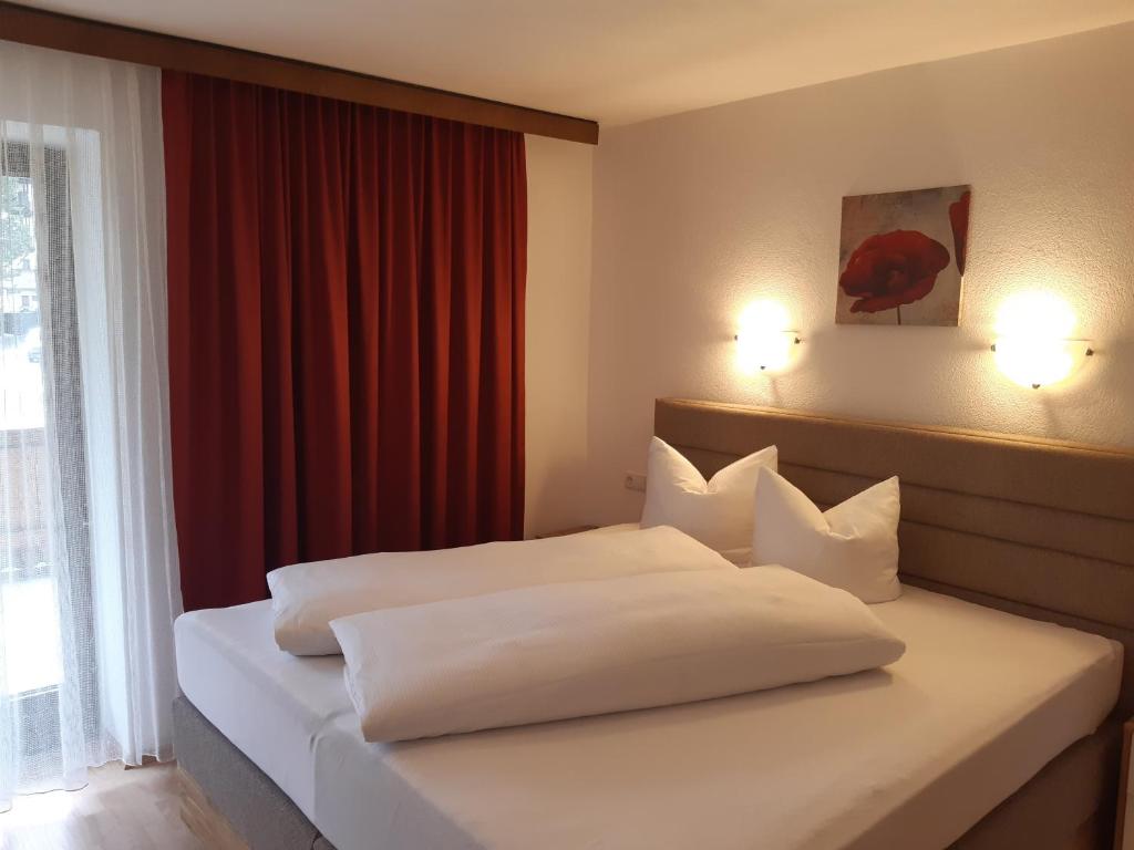 Posteľ alebo postele v izbe v ubytovaní Landhaus Klausnerhof Hotel Garni