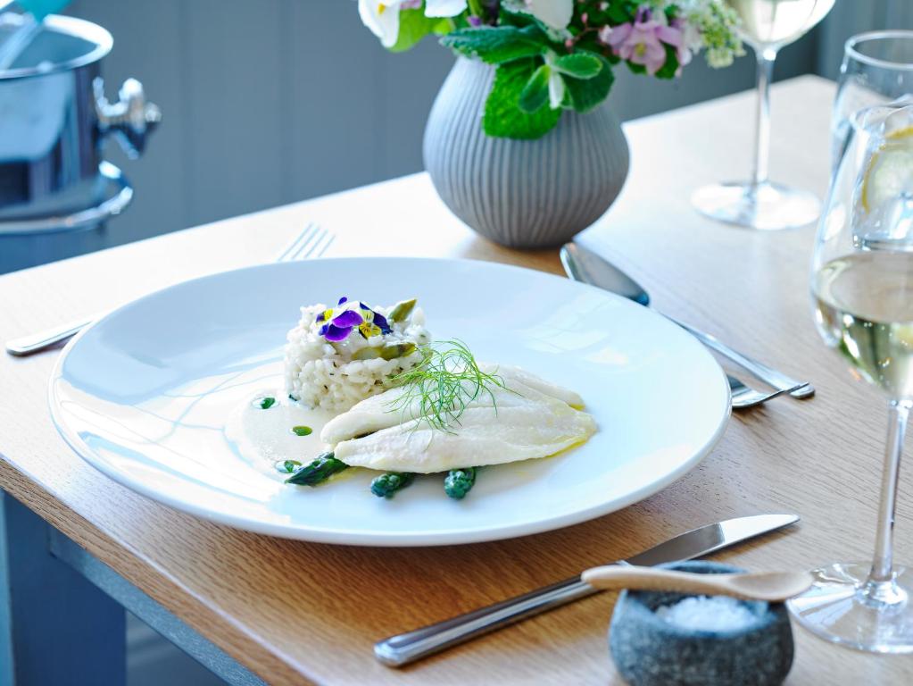 a white plate with food on a table at Dunmore House Hotel in Clonakilty