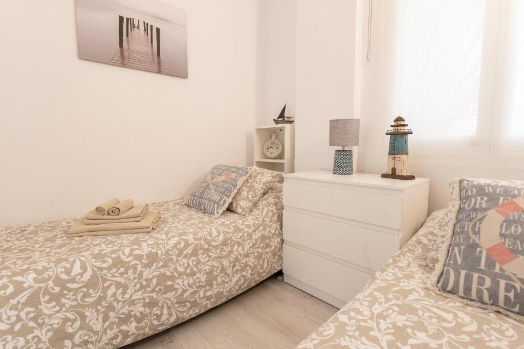 Posteľ alebo postele v izbe v ubytovaní Apartamentos Stil Mar Anna - Stil Mar Jardin Anna