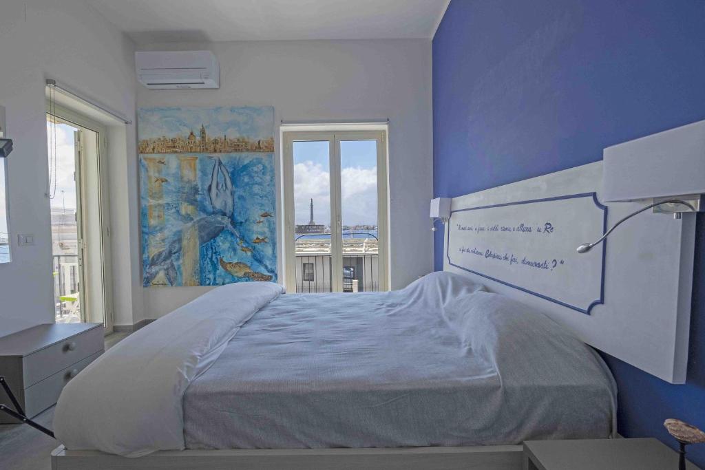 Postel nebo postele na pokoji v ubytování Miti Dello Stretto B&B