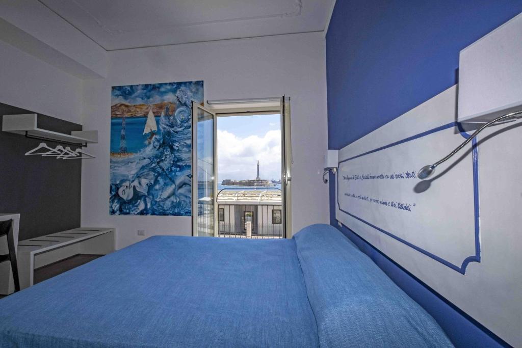 Postel nebo postele na pokoji v ubytování Miti Dello Stretto B&B
