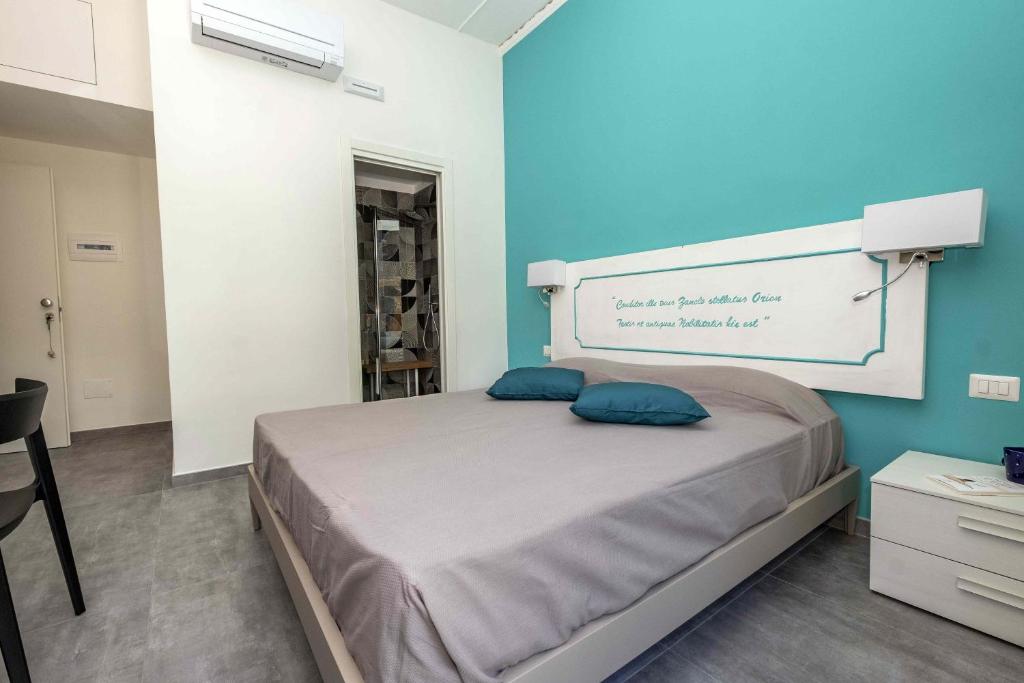 Postel nebo postele na pokoji v ubytování Miti Dello Stretto B&B
