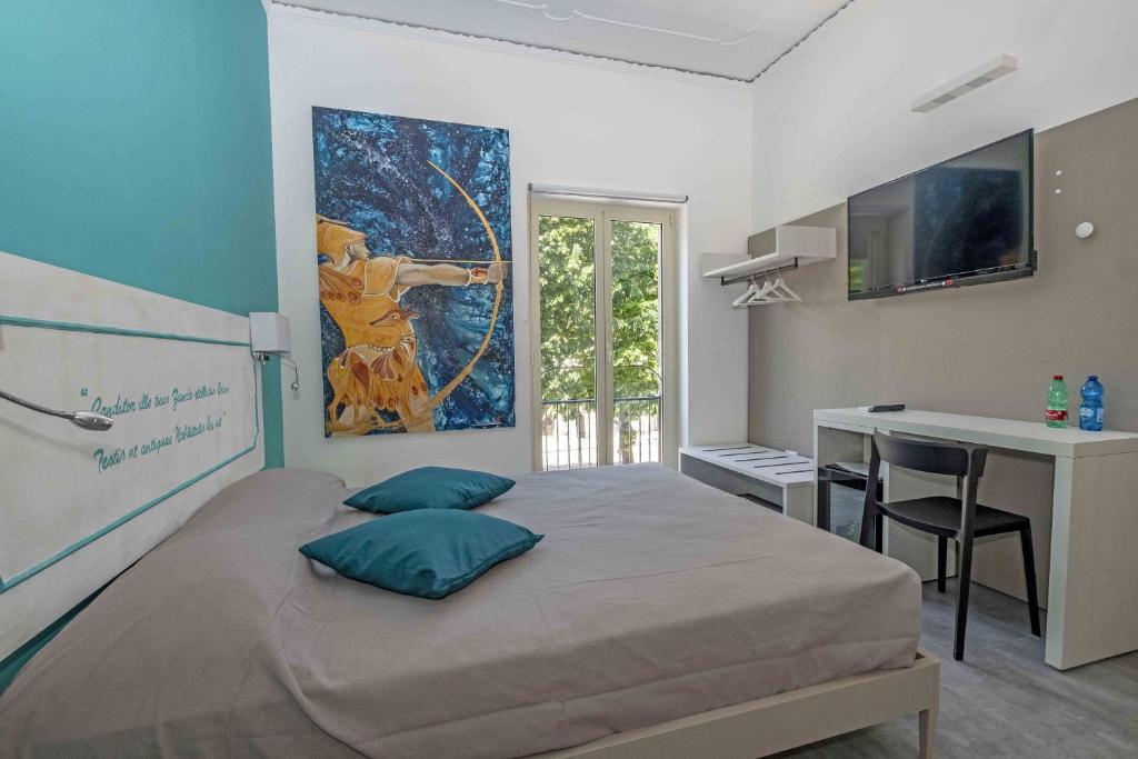 Postel nebo postele na pokoji v ubytování Miti Dello Stretto B&B
