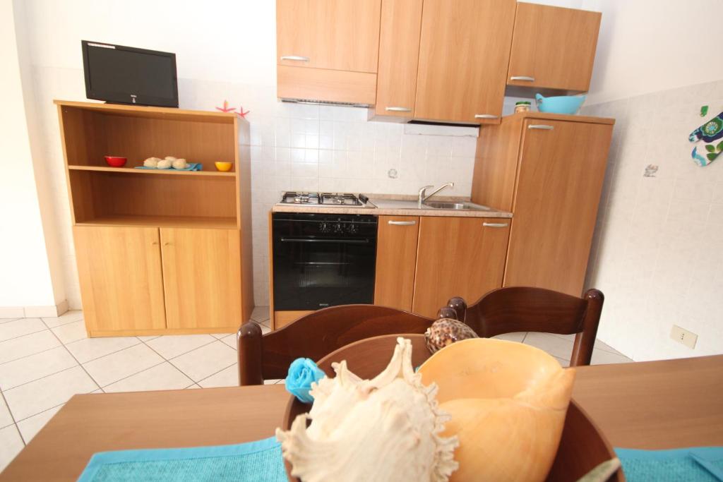 Kuchyň nebo kuchyňský kout v ubytování Acquasmeralda appartamento 03