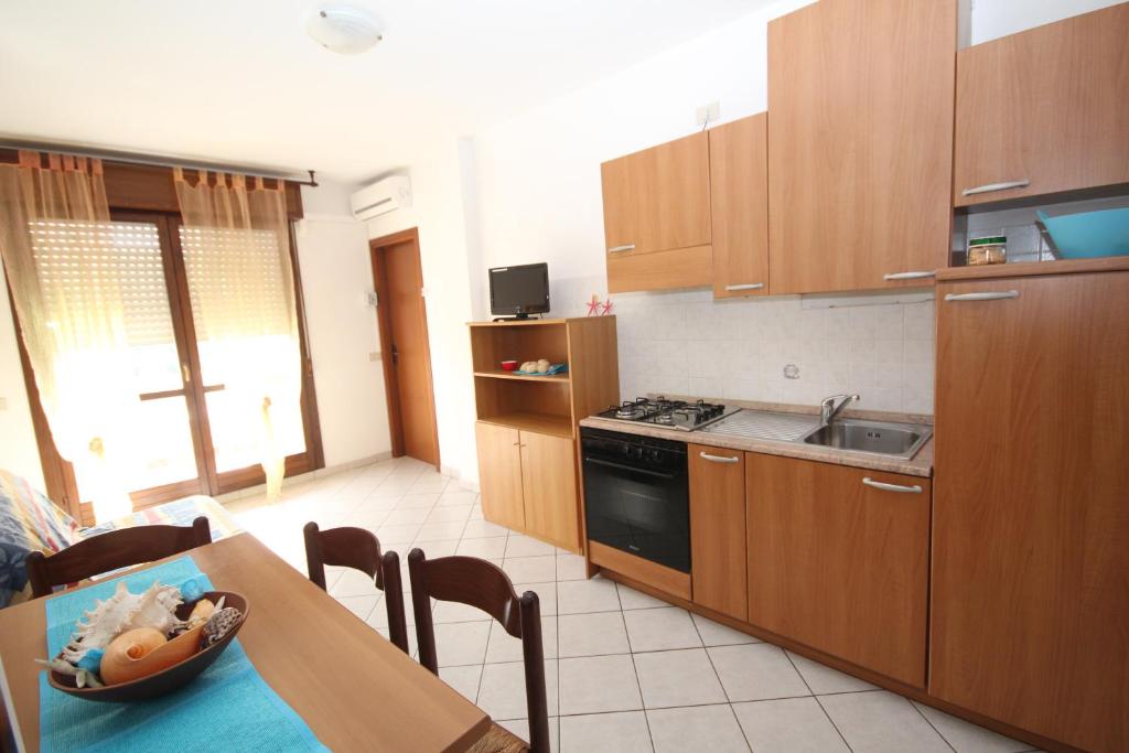 Kuchyň nebo kuchyňský kout v ubytování Acquasmeralda appartamento 03