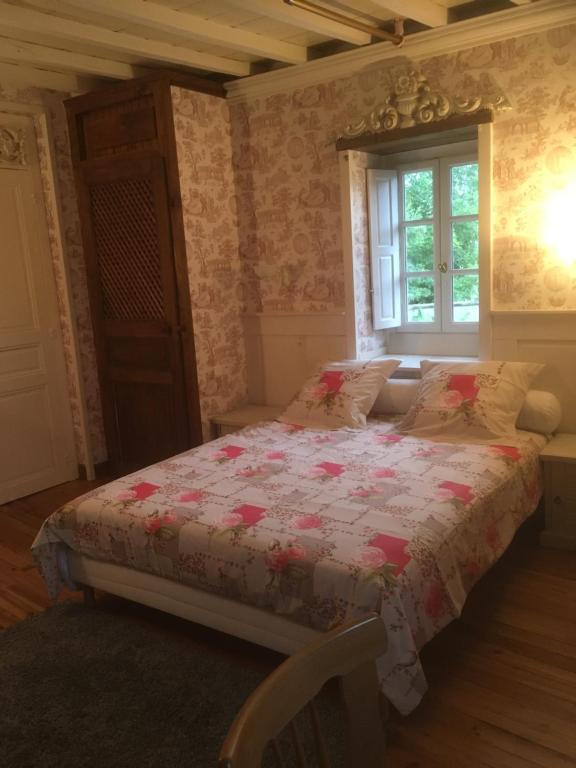 Postel nebo postele na pokoji v ubytování Chez Mamylette