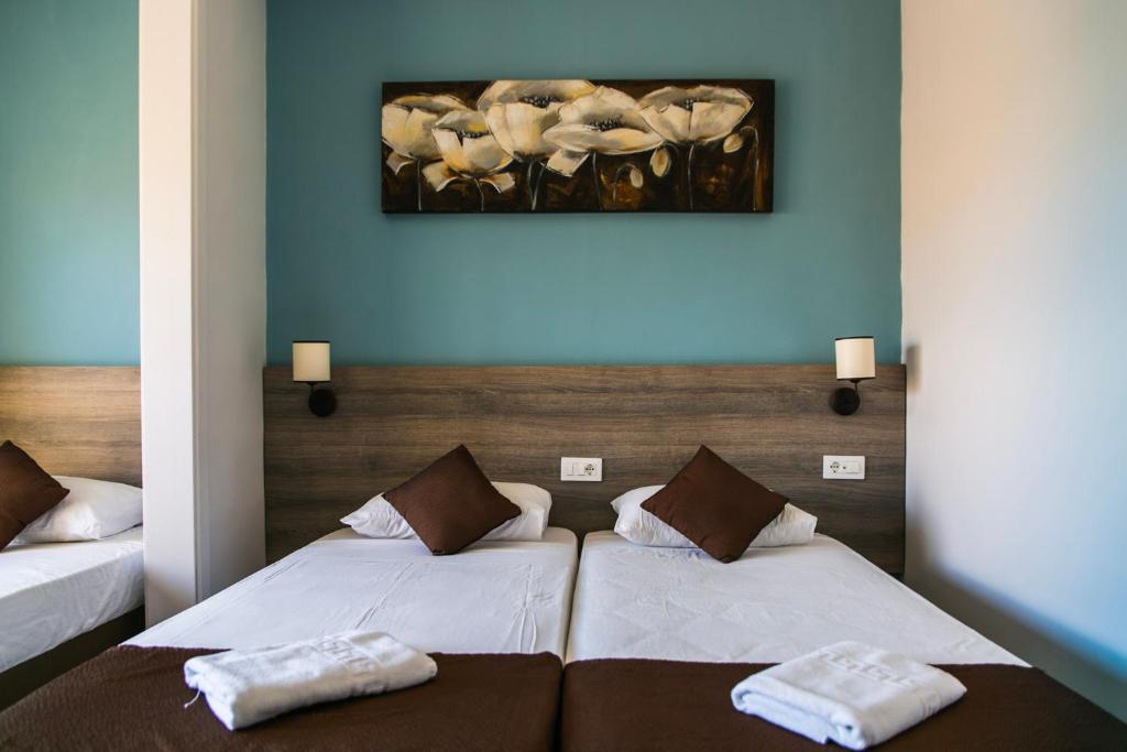 Postel nebo postele na pokoji v ubytování Beach Garden Hotel