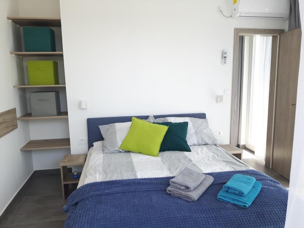 Postel nebo postele na pokoji v ubytování Apartmani Dalmacjia