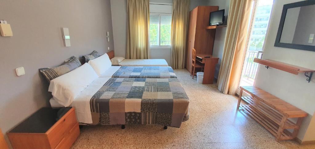 Posteľ alebo postele v izbe v ubytovaní Marinada Cambrils