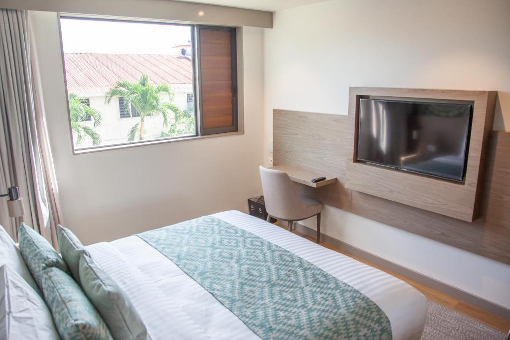 Postel nebo postele na pokoji v ubytování Lava Hotel
