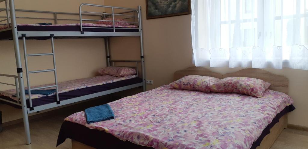 Postel nebo postele na pokoji v ubytování Little Amber Apartments