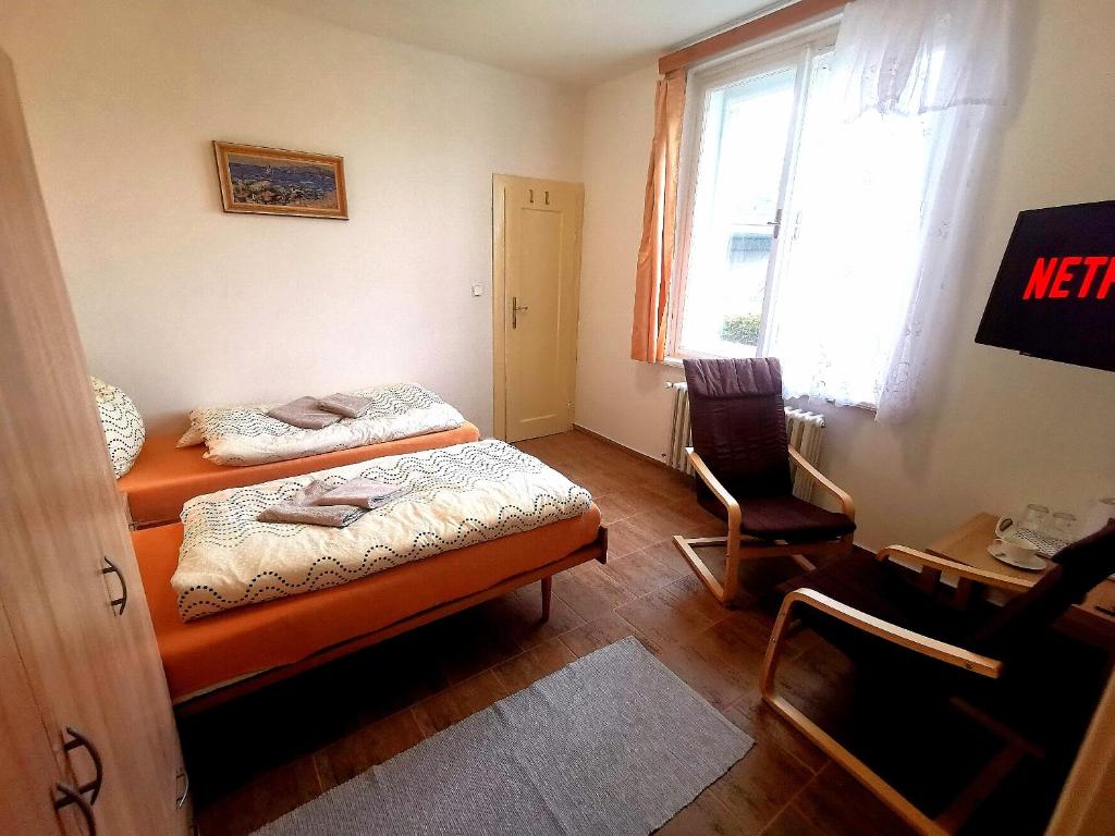 Postel nebo postele na pokoji v ubytování Penzion U Juráše